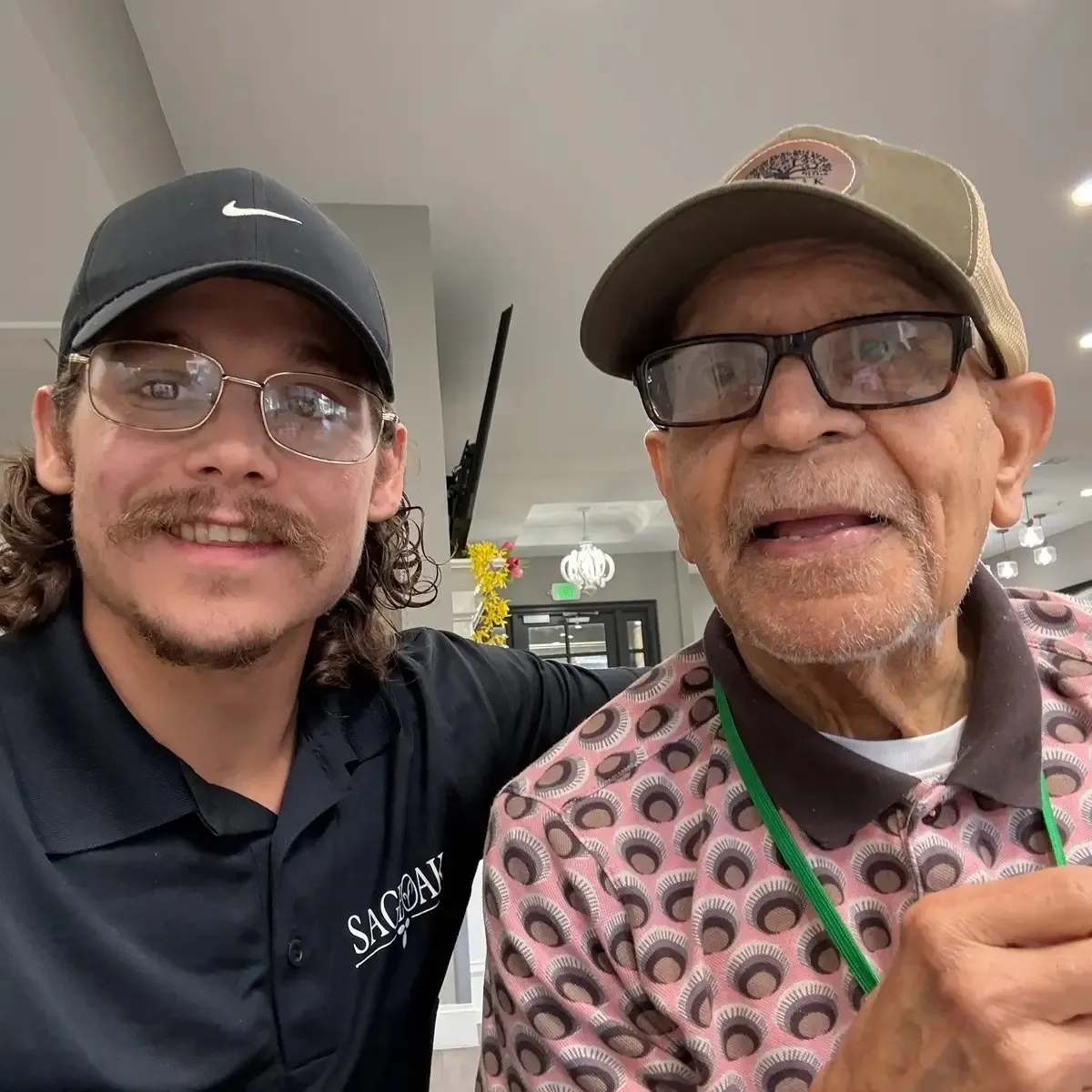 A team member and a resident taking a selfie in Colleyville